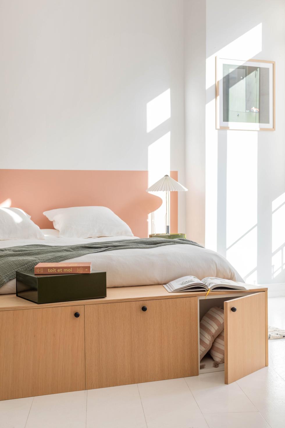 A natural oak bed end by Plum Living