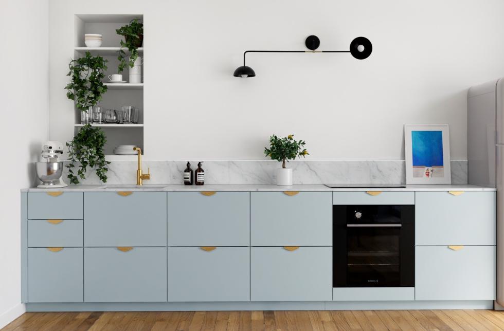 Gray Almond kitchen with brass Delta handles.